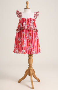 Printed cotton sleeveless dress. Detailed with frils on shoulder and waist