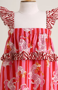 Printed cotton sleeveless dress. Detailed with frils on shoulder and waist