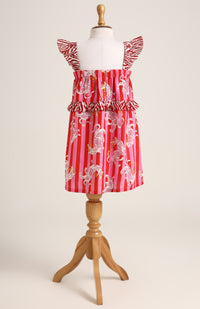 Printed cotton sleeveless dress. Detailed with frils on shoulder and waist