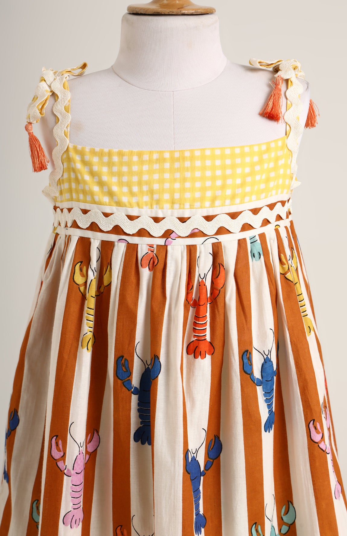 Lobster colourful print sleeveless dress. Detailed with lace trims on shoulder straps
