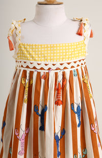 Lobster colourful print sleeveless dress. Detailed with lace trims on shoulder straps