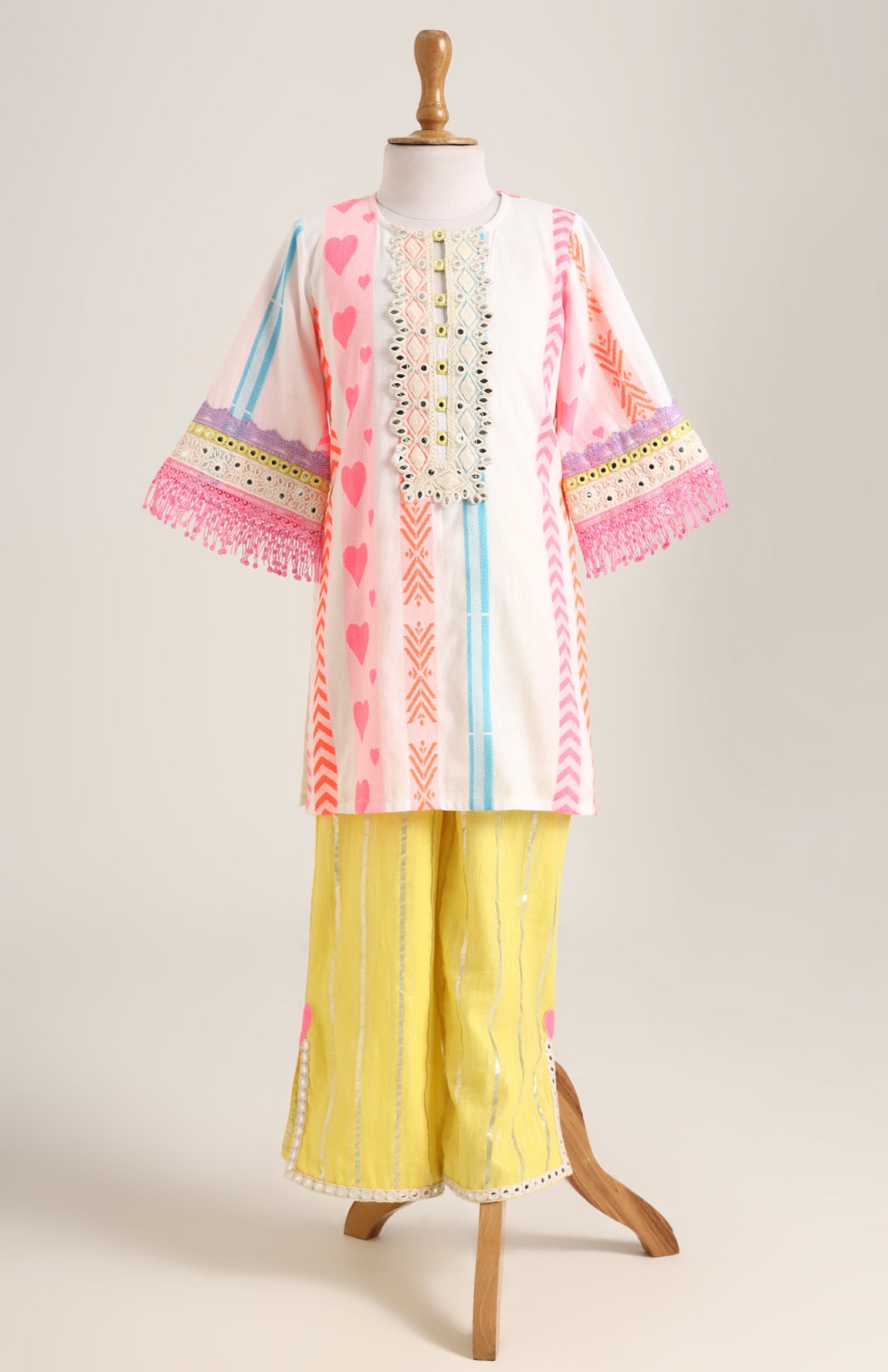 Handloom Cotton Kurta paired with Silver Lurex Pants. Detailed with mirror lace.