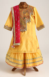 Chanderi Plain Kurta and Sharara paired with Soft Net dupatta. Detailed with big Neck Patch and Gota Patti/Lace
