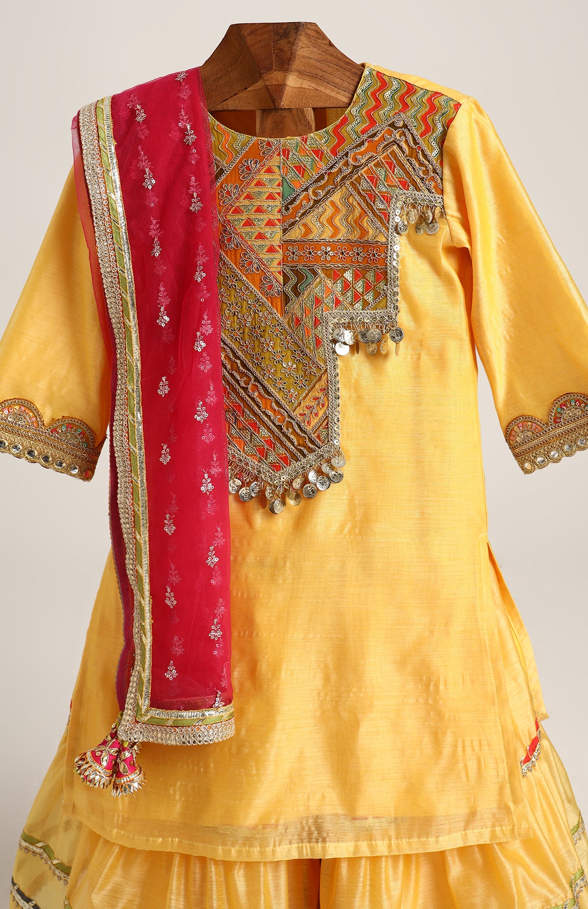 Chanderi Plain Kurta and Sharara paired with Soft Net dupatta. Detailed with big Neck Patch and Gota Patti/Lace