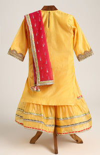 Chanderi Plain Kurta and Sharara paired with Soft Net dupatta. Detailed with big Neck Patch and Gota Patti/Lace