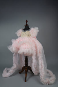 Embellised layered pink dress with detachable trail and bow with swirled bowie hairband