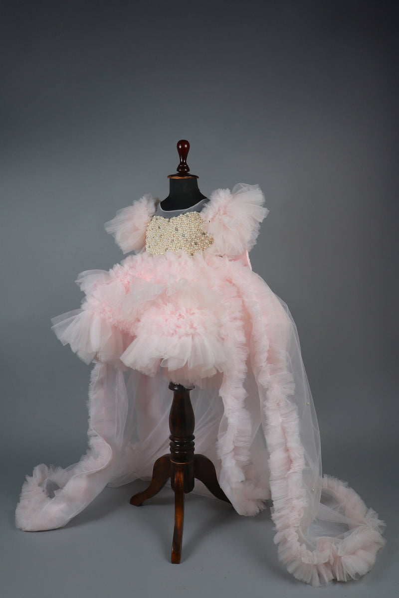 Embellised layered pink dress with detachable trail and bow with swirled bowie hairband