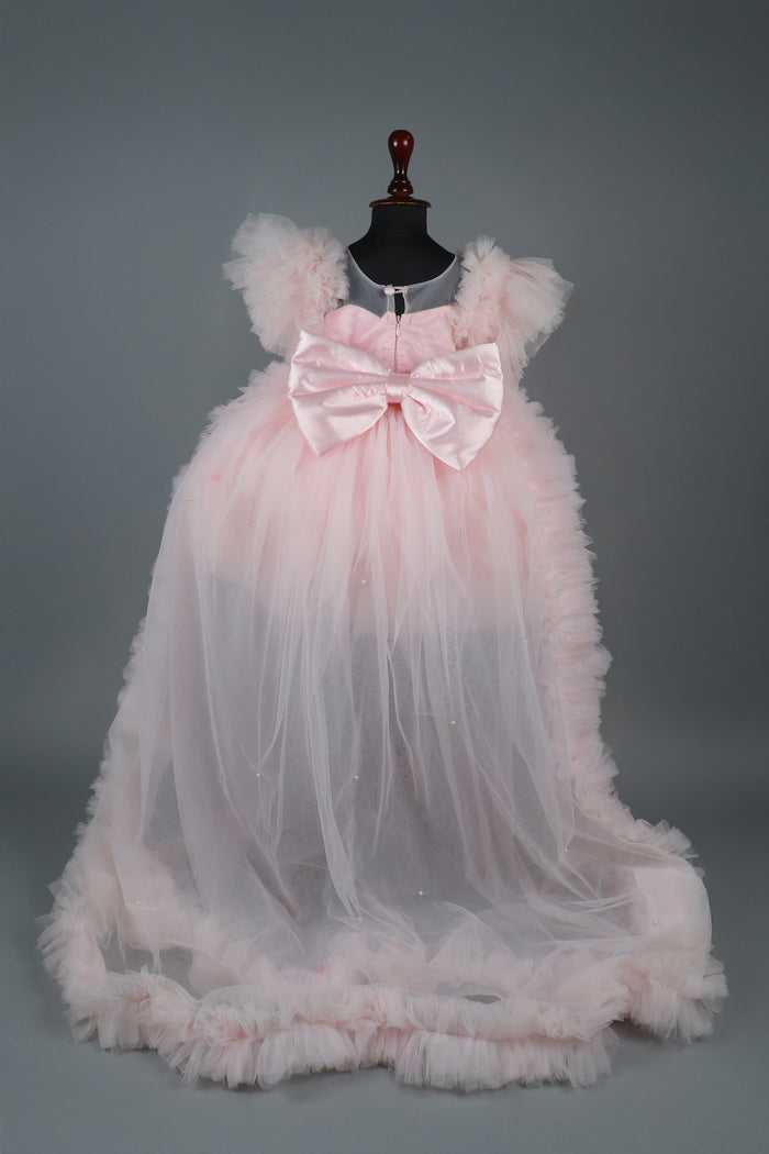 Embellised layered pink dress with detachable trail and bow with swirled bowie hairband