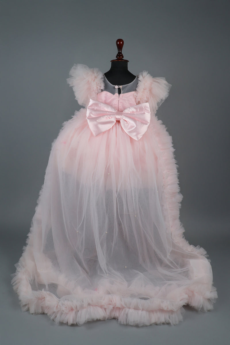 Embellised layered pink dress with detachable trail and bow with swirled bowie hairband