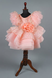 peach sequence embellised dress featurling a detachable trail and bow with swired bow headband