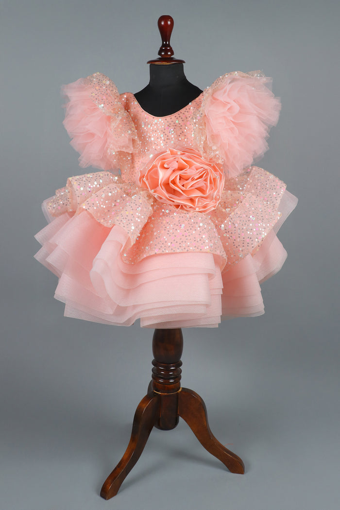 peach sequence embellised dress featurling a detachable trail and bow with swired bow headband