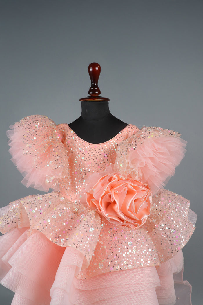 peach sequence embellised dress featurling a detachable trail and bow with swired bow headband