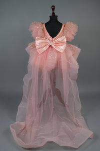 peach sequence embellised dress featurling a detachable trail and bow with swired bow headband