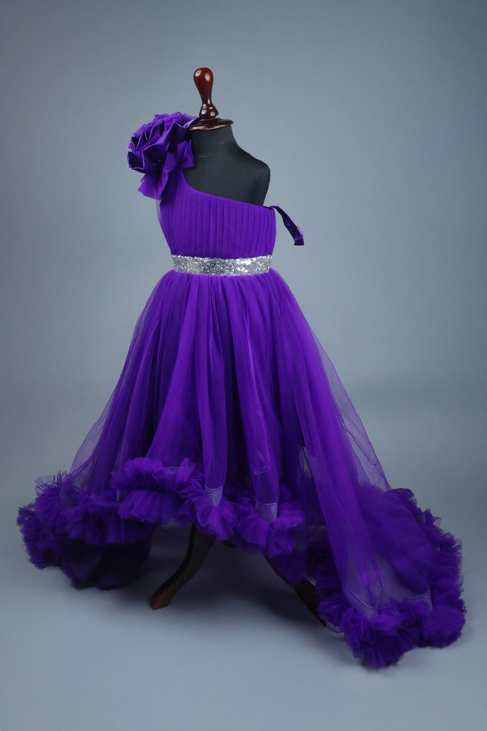 blue one shoulder high low dress with matching head band and detachable bow