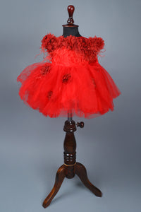 red flower dress with feathers and headband with detachable bow