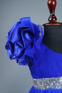 Blue one shoulder high low dress with matching head band and detachable bow