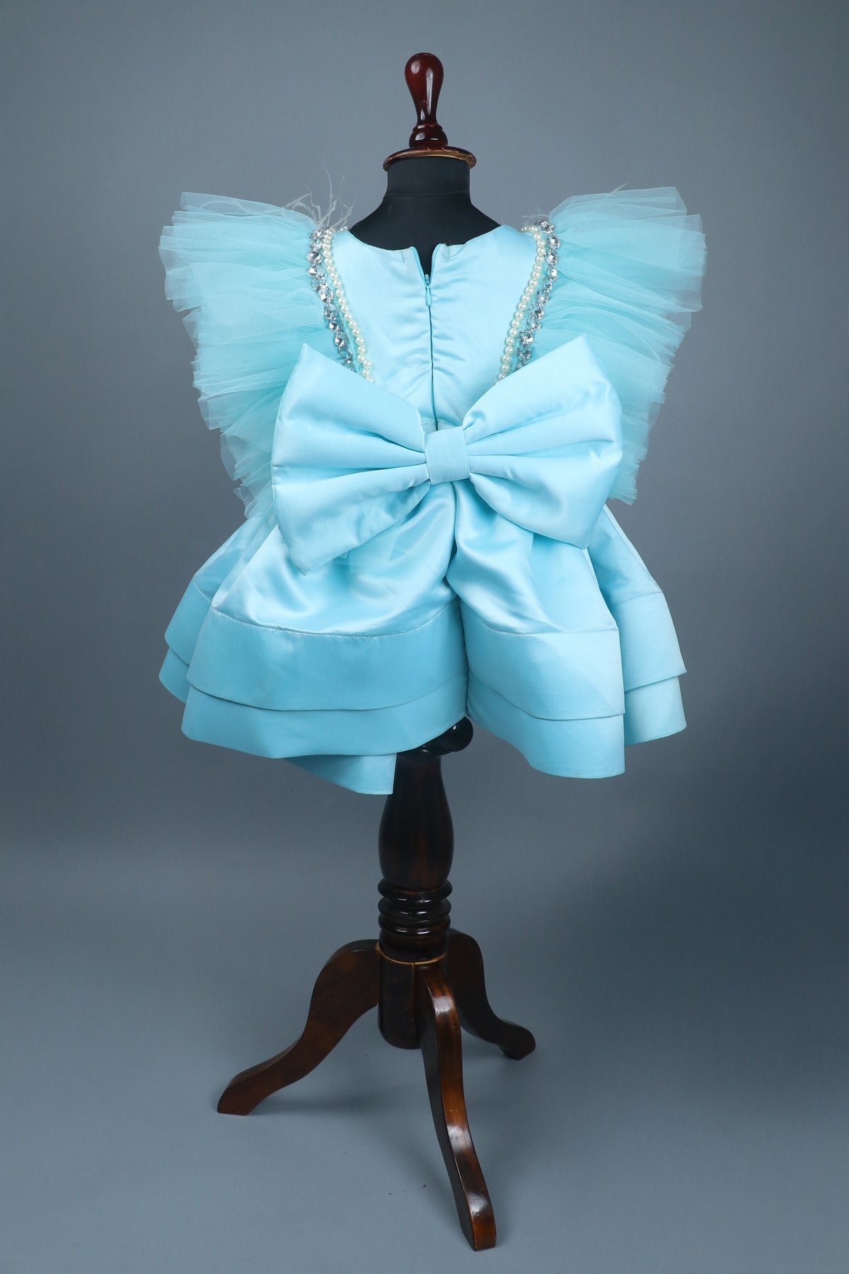 sky blue dress with purles work in chloi and feathers with head band and detachable bow