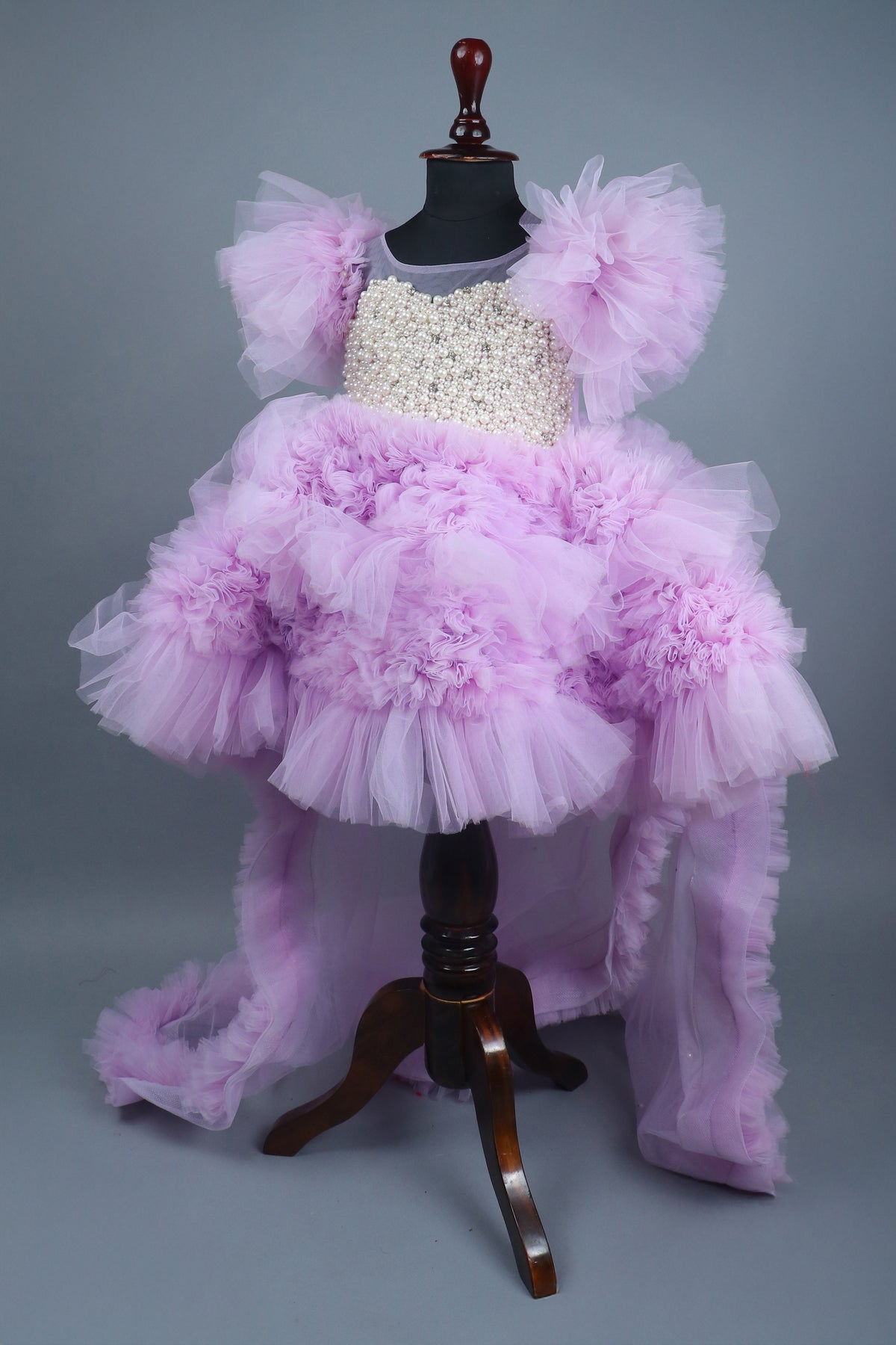 Embellised layered lilac dress with detachable trail and bow with swirled bowie hairband