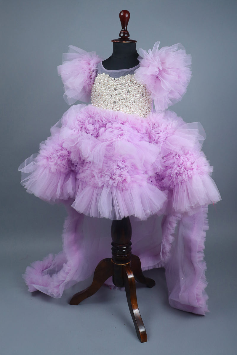 Embellised layered lilac dress with detachable trail and bow with swirled bowie hairband