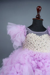 Embellised layered lilac dress with detachable trail and bow with swirled bowie hairband