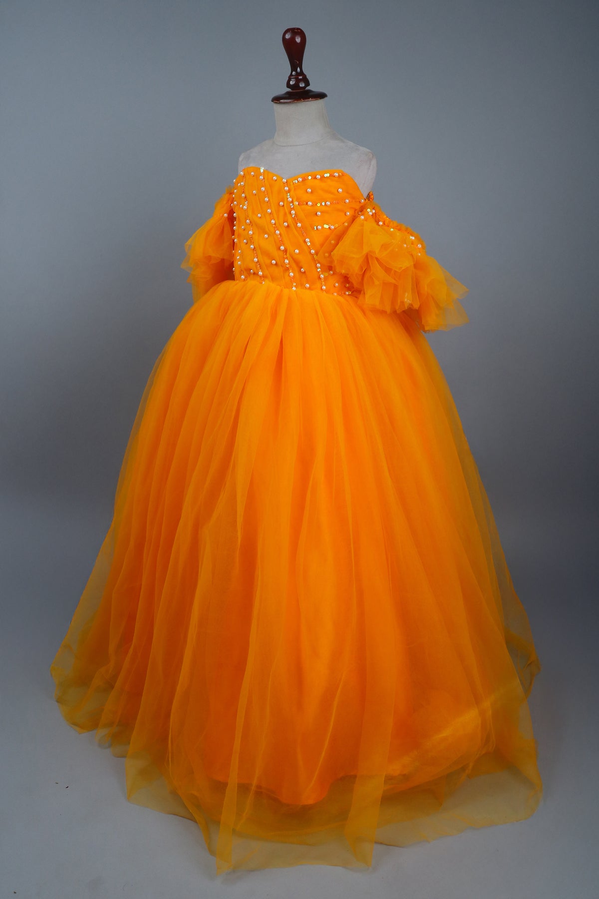 yellow full length gown with head band and detachable bow