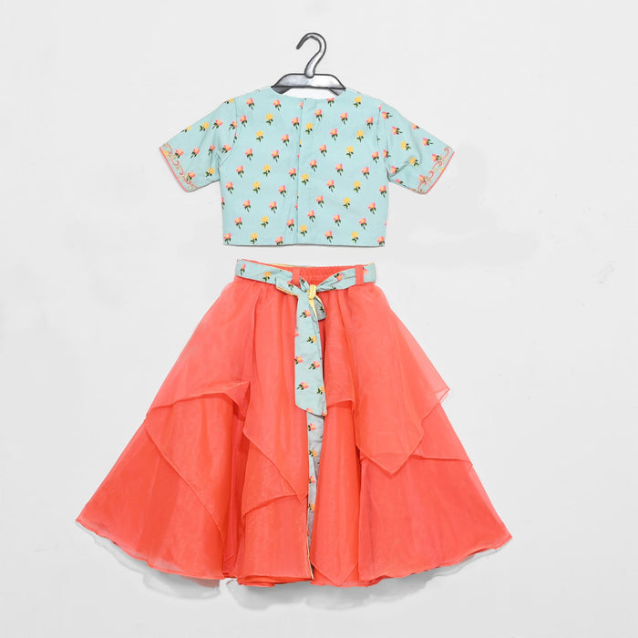 Aqua Green Printed Blouse With Pan Embroidered Collar And Asymmetrical Peach Ghaghra And Printed Belt