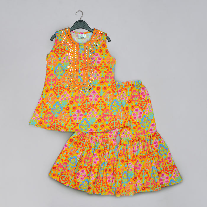 MUSTARD FLORAL PRINTED MIRROW WORK AND EMBROIDERED TOP WITH FLORAL PRINTED SHARARA SET