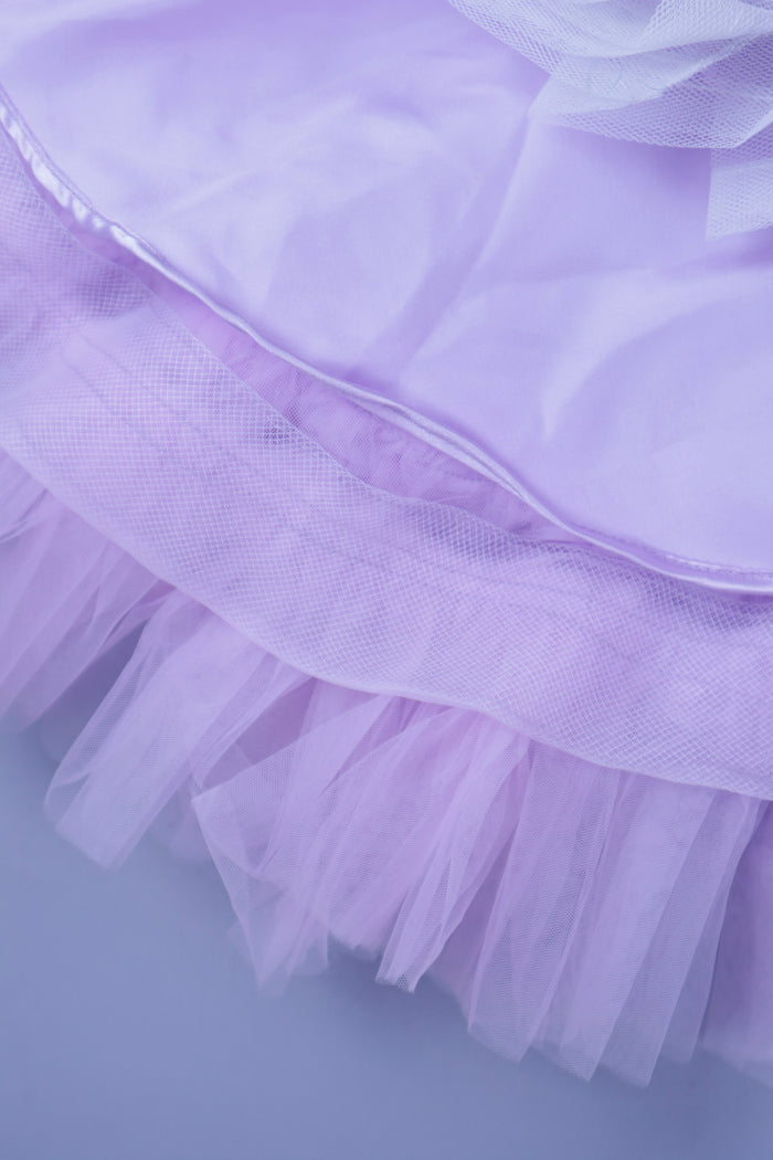 Embellised layered lilac dress with detachable trail and bow with swirled bowie hairband