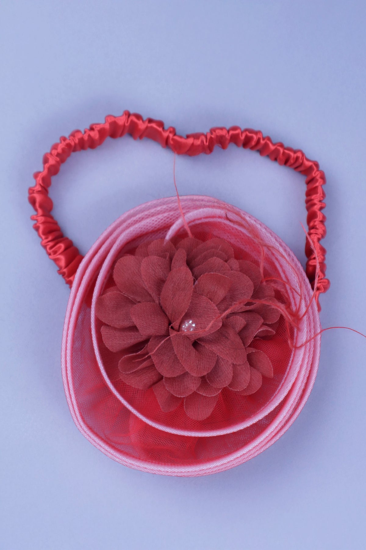 red flower dress with feathers and headband with detachable bow