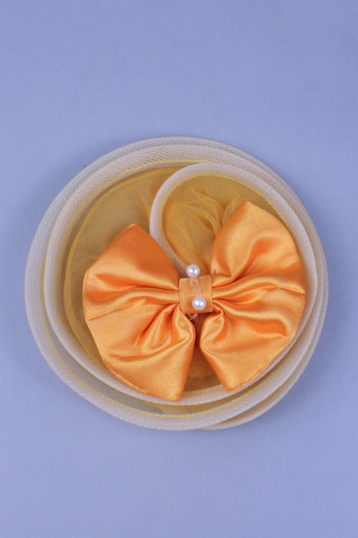 yellow full length gown with head band and detachable bow