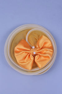 yellow full length gown with head band and detachable bow